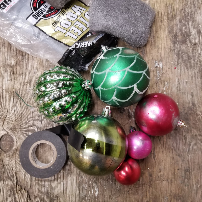 Age cheap ornaments by rubbing down details, glitter and paint finishes on inexpensive plastic ornaments.  DIY by Aaron Christensen