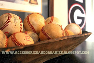 Display baseballs in old trugs or  containers.