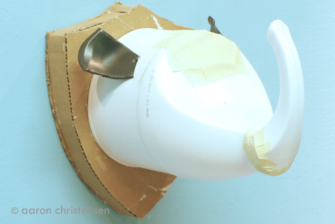 Kids taxidermy craft rhino made from recyclables.  Super easy DIY.